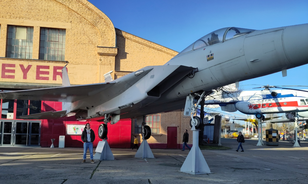 Nick stands under an F-15 at Speyer Techink Museum