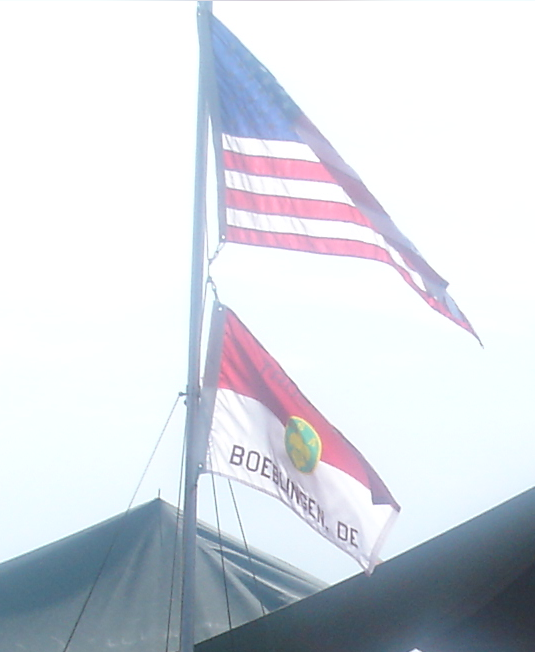 Flags fly at camp during a multi-troop activity